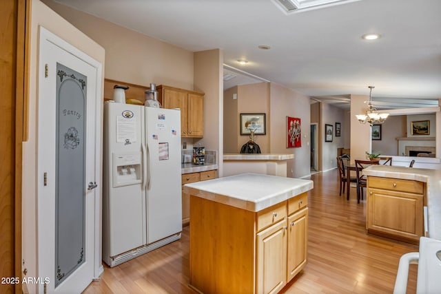2041 W Hacienda Way, Show Low, AZ 85901 - kitchen with white fridge with ice dispenser, tile counters, light wood finished floors, and recessed lighting