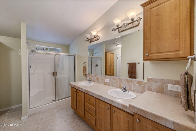2041 W Hacienda Way, Show Low, AZ 85901 - bathroom with double vanity, a shower stall, baseboards, and tile patterned flooring