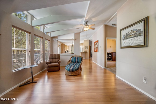 2041 W Hacienda Way, Show Low, AZ 85901 - sitting room with wood finished floors, plenty of natural light, lofted ceiling, and a ceiling fan