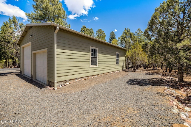 2041 W Hacienda Way, Show Low, AZ 85901 - view of side of home with a garage and an outdoor structure