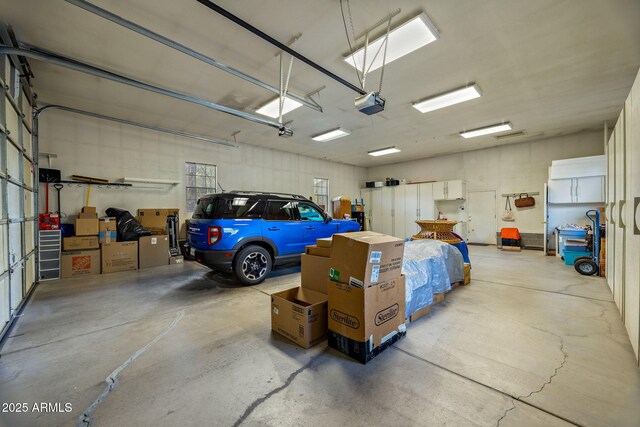 2041 W Hacienda Way, Show Low, AZ 85901 - garage featuring a garage door opener