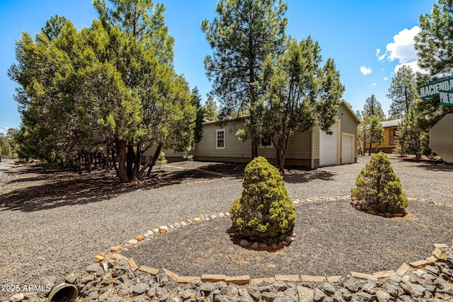 2041 W Hacienda Way, Show Low, AZ 85901 - view of front facade featuring a garage and driveway