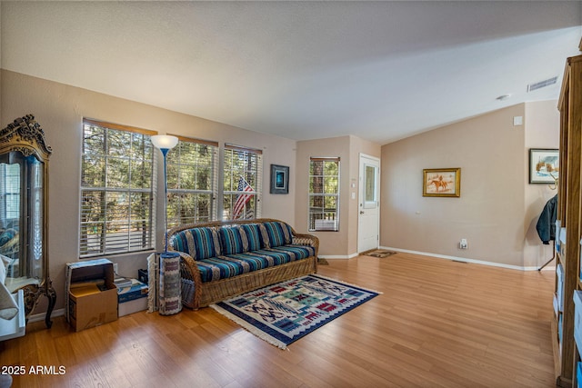 2041 W Hacienda Way, Show Low, AZ 85901 - living room with wood finished floors, lofted ceiling, and baseboards
