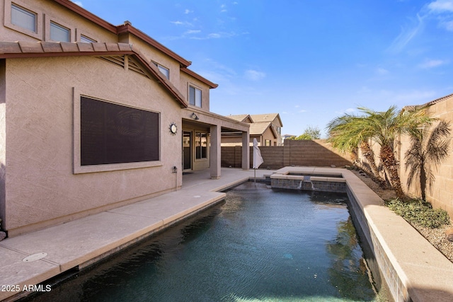 view of swimming pool with an in ground hot tub