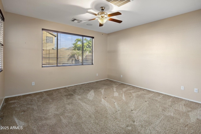 spare room with ceiling fan and carpet flooring