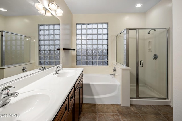 bathroom featuring tile patterned flooring, vanity, and independent shower and bath