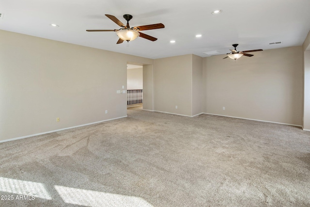 carpeted empty room featuring ceiling fan