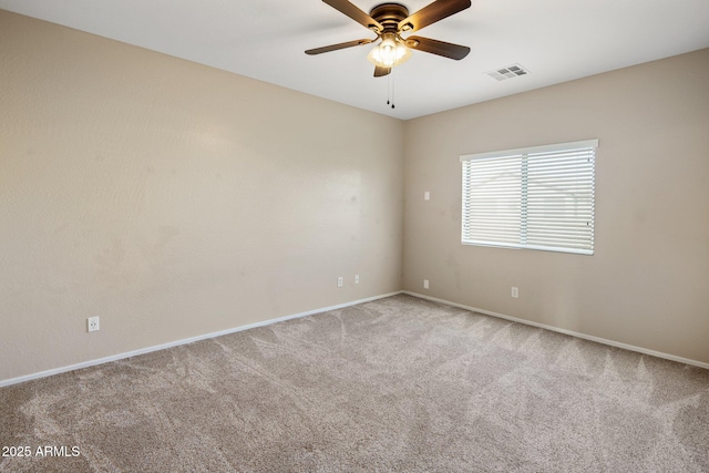 spare room with light carpet and ceiling fan