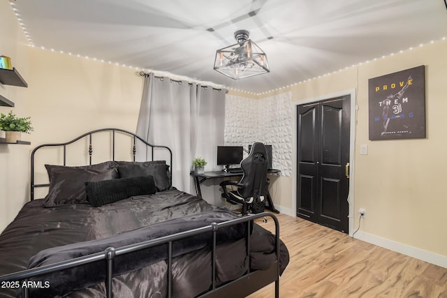 bedroom with light hardwood / wood-style floors