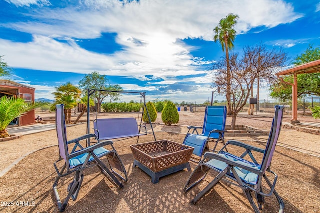 view of patio with a fire pit