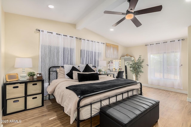 bedroom featuring ceiling fan, lofted ceiling with beams, and light wood-type flooring