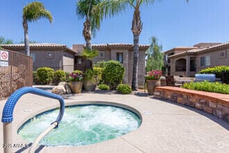 view of swimming pool featuring a community hot tub