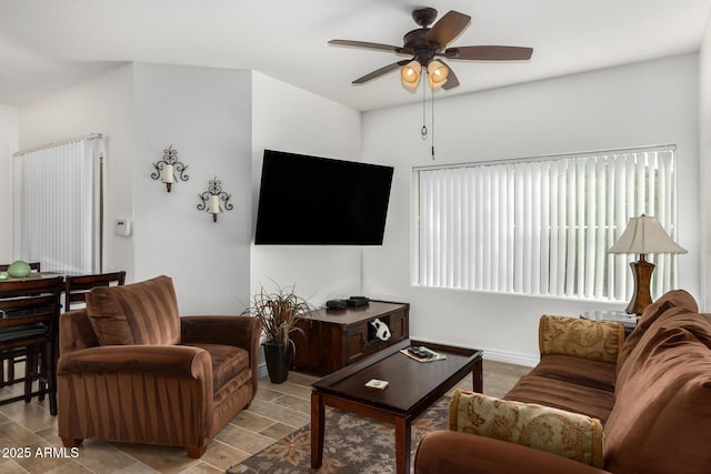 living area with ceiling fan