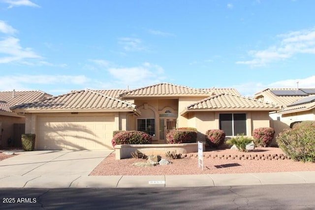 mediterranean / spanish-style home featuring a garage