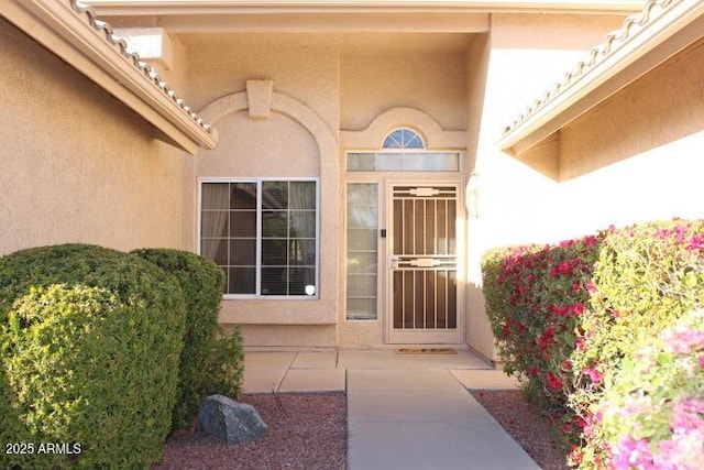 property entrance featuring a patio