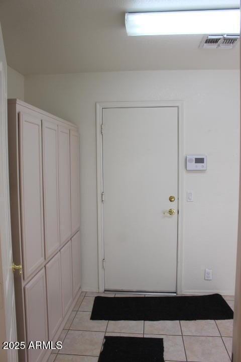 entryway featuring light tile patterned flooring