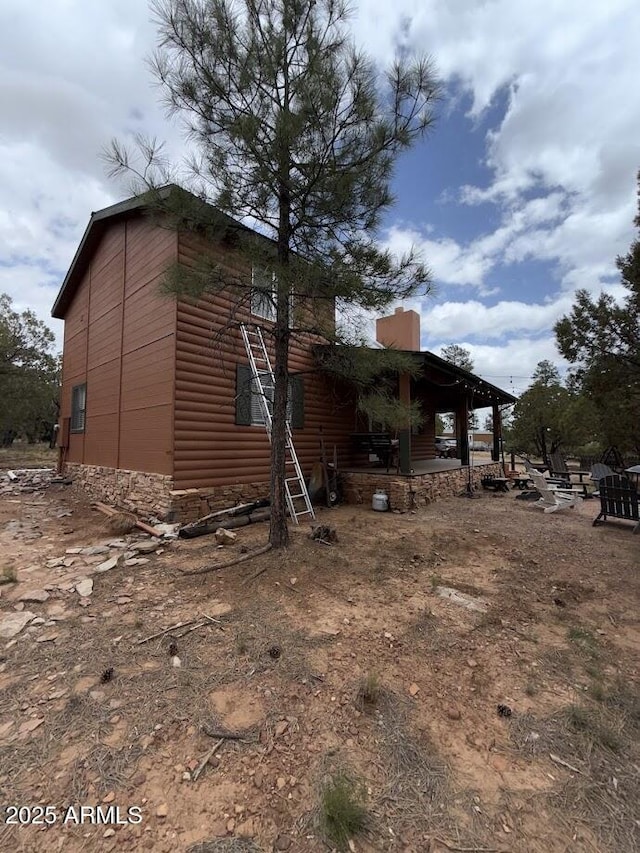 691 N Pyle Ranch Rd, Payson, AZ 85541 - view of side of property featuring a chimney and faux log siding