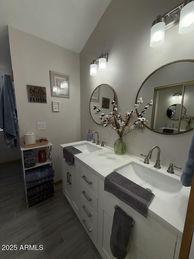 691 N Pyle Ranch Rd, Payson, AZ 85541 - full bathroom with double vanity, vaulted ceiling, and wood tiled floors