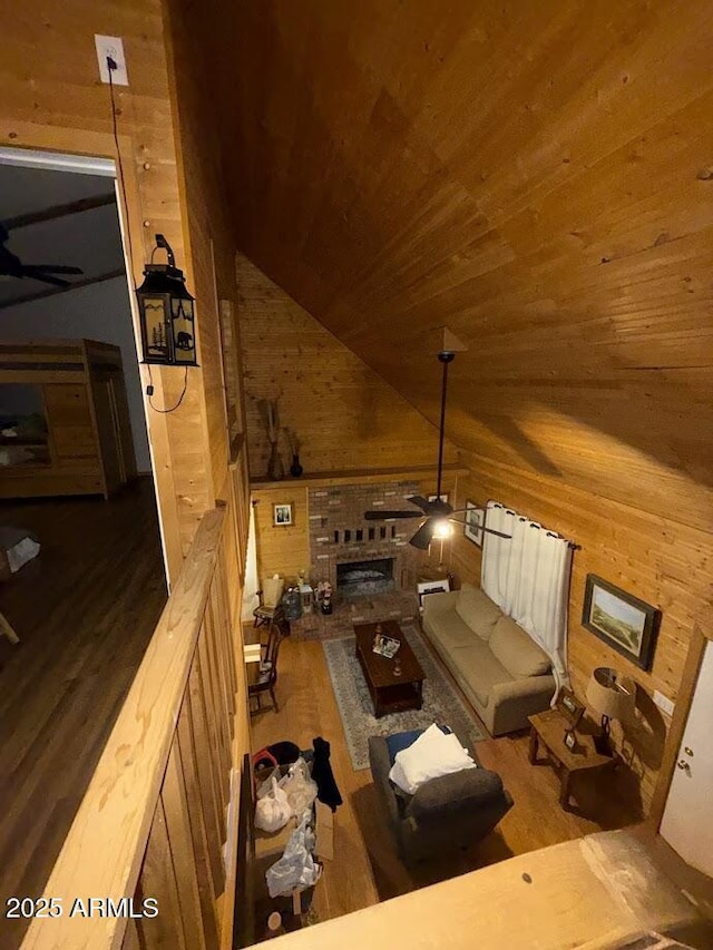 691 N Pyle Ranch Rd, Payson, AZ 85541 - living area with wood walls, wood finished floors, vaulted ceiling, wooden ceiling, and ceiling fan