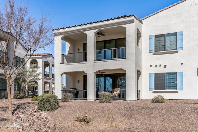 rear view of property with stucco siding