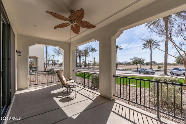 balcony featuring covered porch and ceiling fan