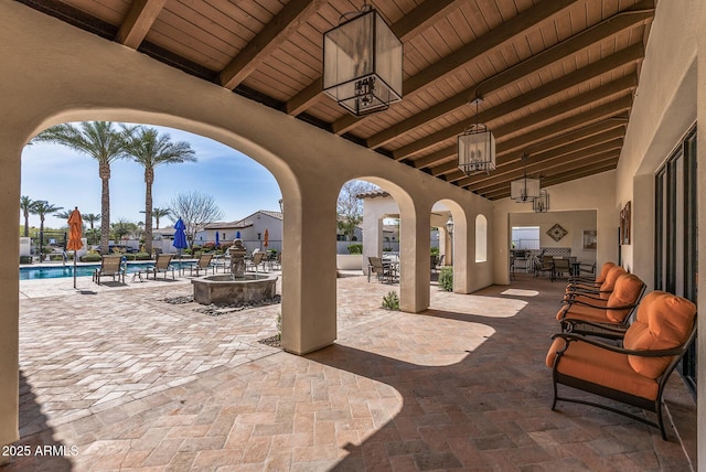 view of patio with a community pool