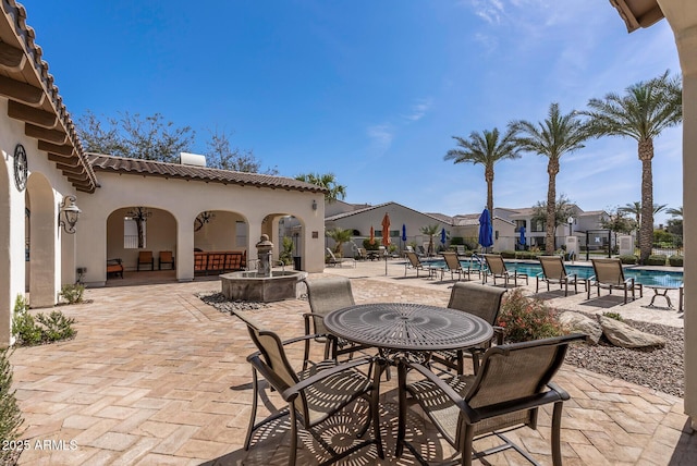 view of patio featuring a community pool