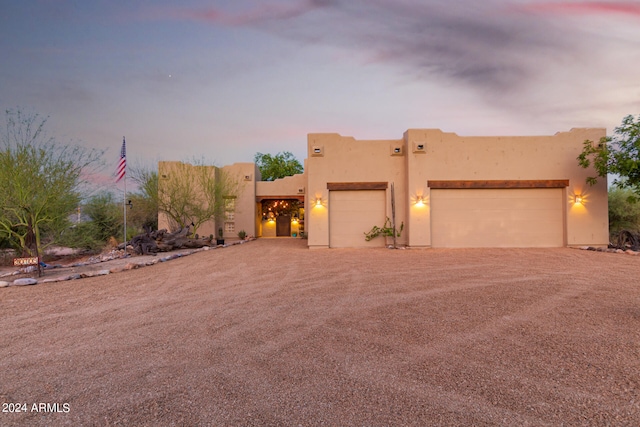 southwest-style home featuring a garage