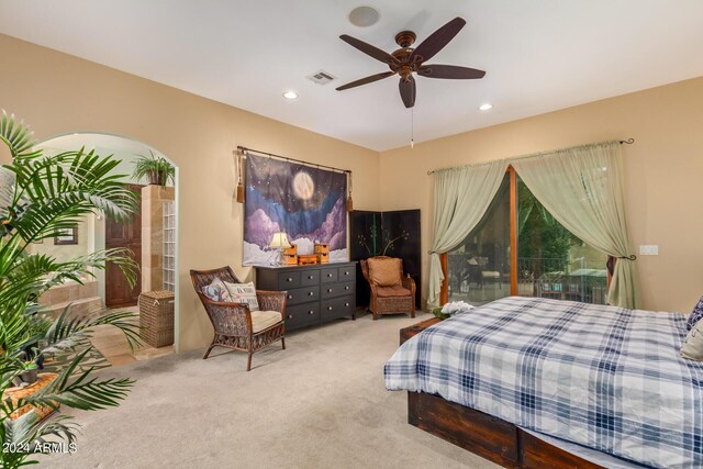 bedroom featuring light carpet and ceiling fan