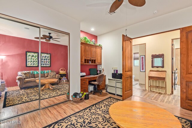 tiled bedroom featuring ceiling fan