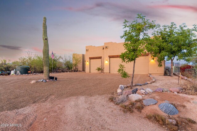 southwest-style home featuring a garage