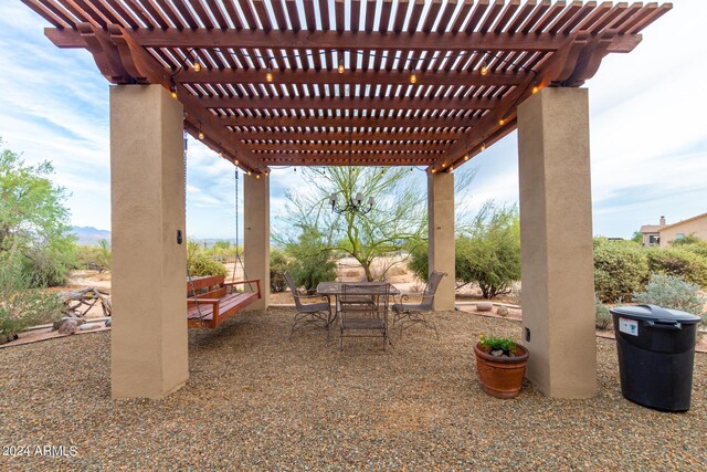 view of yard with a fire pit and a pergola