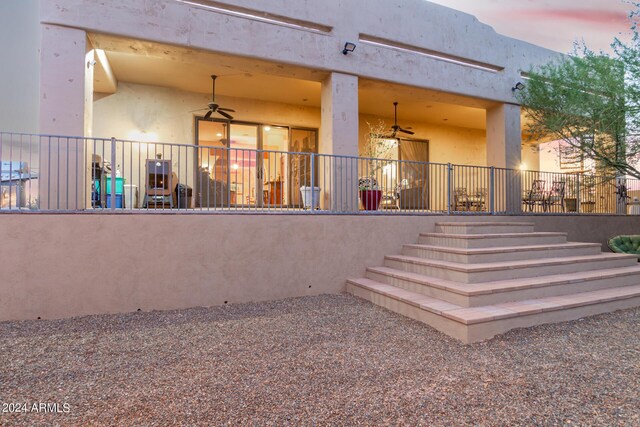 exterior space with a grill and ceiling fan