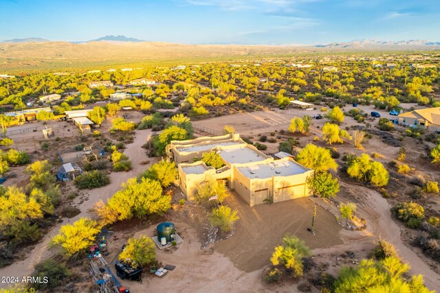 birds eye view of property with a mountain view