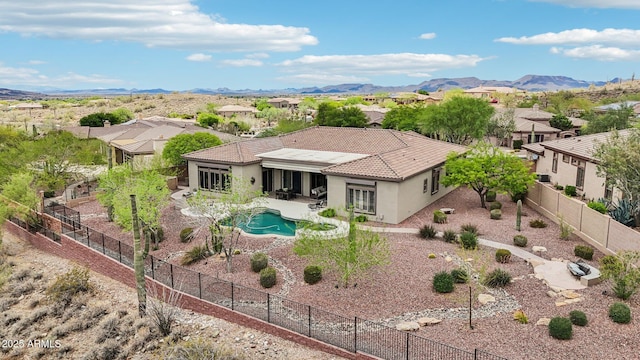 42429 N Cross Timbers Ct, Anthem, AZ 85086 - rear view of house with stucco siding, a tile roof, a fenced backyard, and a patio area