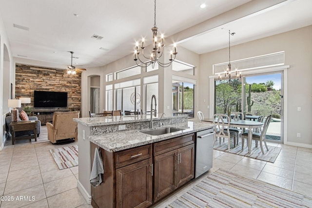42429 N Cross Timbers Ct, Anthem, AZ 85086 - kitchen featuring a sink, dishwasher, a chandelier, light tile patterned floors, and hanging light fixtures