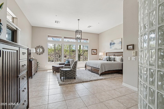 42429 N Cross Timbers Ct, Anthem, AZ 85086 - bedroom featuring a chandelier, baseboards, and light tile patterned floors