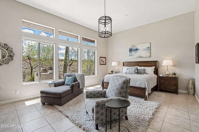 42429 N Cross Timbers Ct, Anthem, AZ 85086 - bedroom with light tile patterned floors, baseboards, and a chandelier