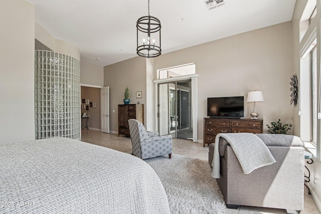 42429 N Cross Timbers Ct, Anthem, AZ 85086 - bedroom featuring access to exterior, a chandelier, light tile patterned floors, and baseboards