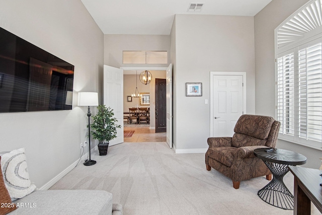 42429 N Cross Timbers Ct, Anthem, AZ 85086 - sitting room featuring light carpet, a chandelier, baseboards, and a high ceiling