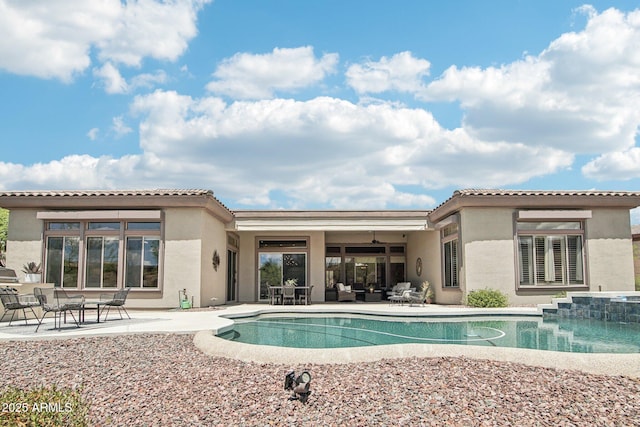 42429 N Cross Timbers Ct, Anthem, AZ 85086 - rear view of house featuring a patio area, an outdoor pool, and stucco siding