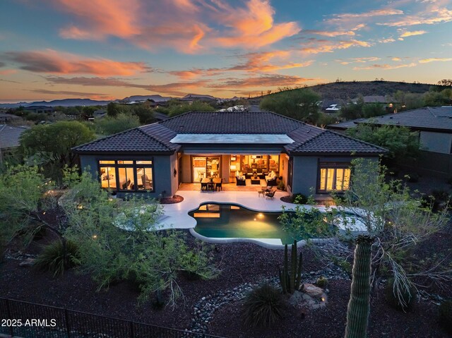 42429 N Cross Timbers Ct, Anthem, AZ 85086 - rear view of house with a tile roof, stucco siding, and a patio