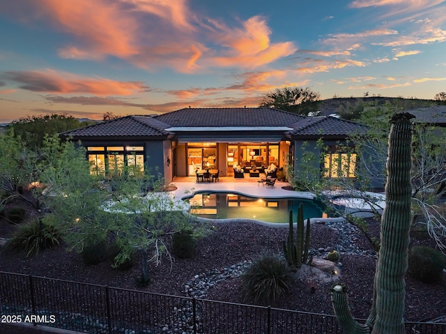 42429 N Cross Timbers Ct, Anthem, AZ 85086 - back of property with a tiled roof, a patio, an outdoor living space, and stucco siding