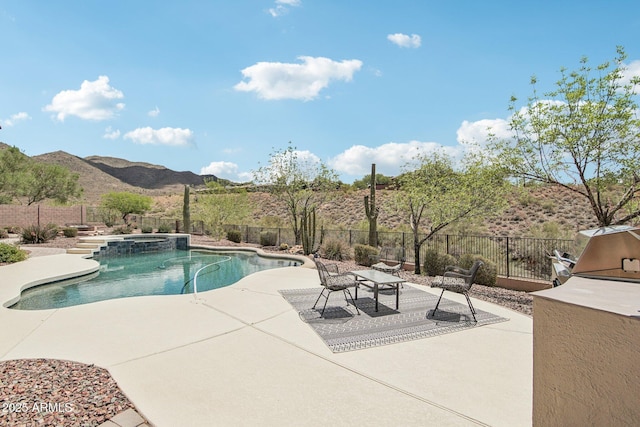 42429 N Cross Timbers Ct, Anthem, AZ 85086 - view of pool with a patio, a fenced backyard, a mountain view, an in-ground hot tub, and a grill