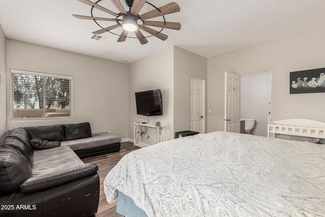 bedroom featuring visible vents, a ceiling fan, baseboards, and wood finished floors