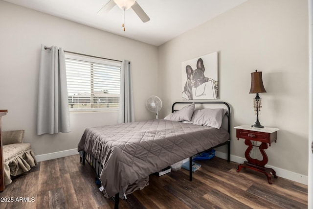 bedroom with ceiling fan, baseboards, and wood finished floors