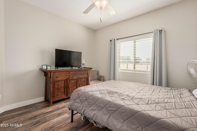 bedroom featuring baseboards, ceiling fan, and dark wood-style flooring