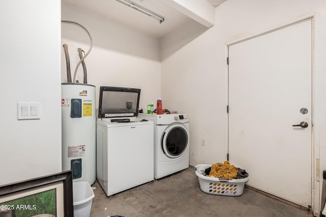 laundry area featuring water heater, laundry area, and washer and clothes dryer