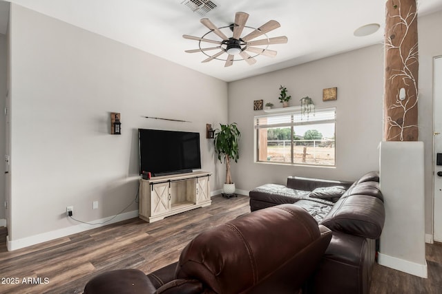 living area with visible vents, baseboards, a ceiling fan, and dark wood-style flooring