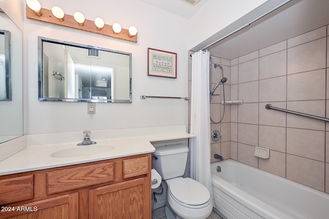 full bathroom featuring vanity, toilet, and shower / tub combo